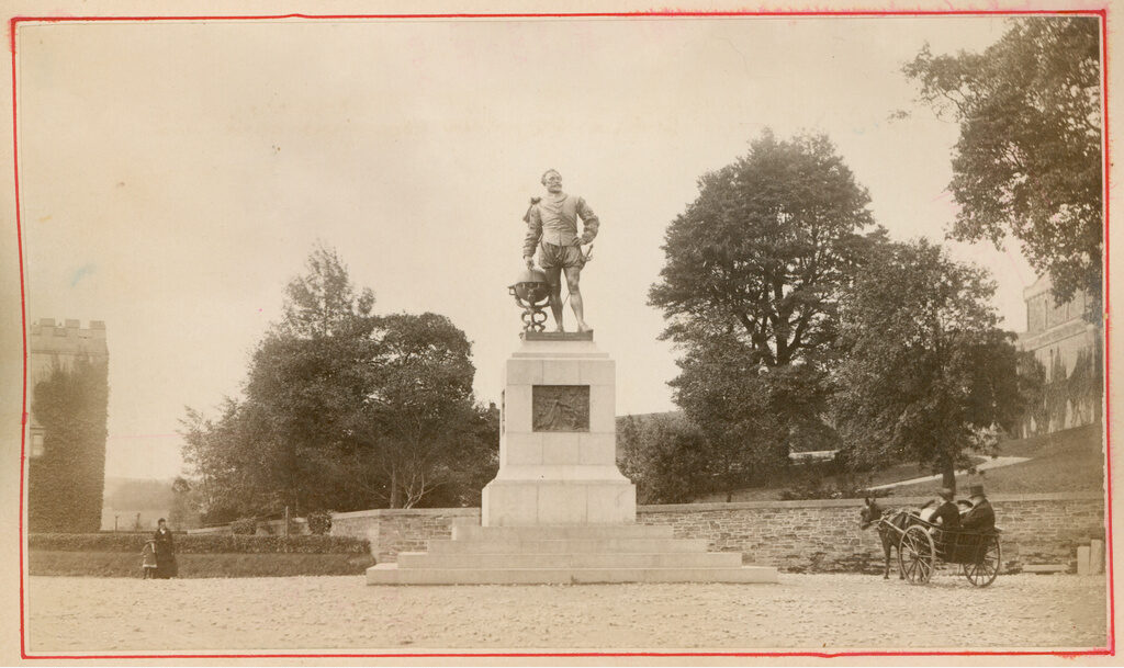 A sepia photo depicting a statue of Sir Francis Drake, taken in Tavistock during the Victorian era.